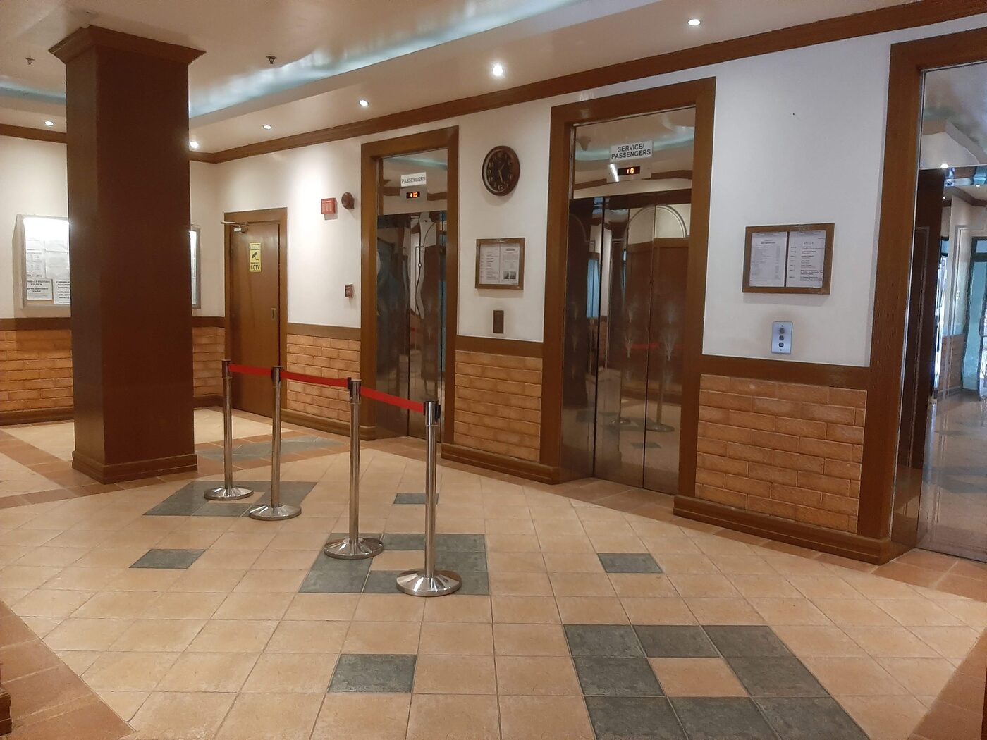 Ground floor lobby with passenger and service elevators at Palm Towers Makati