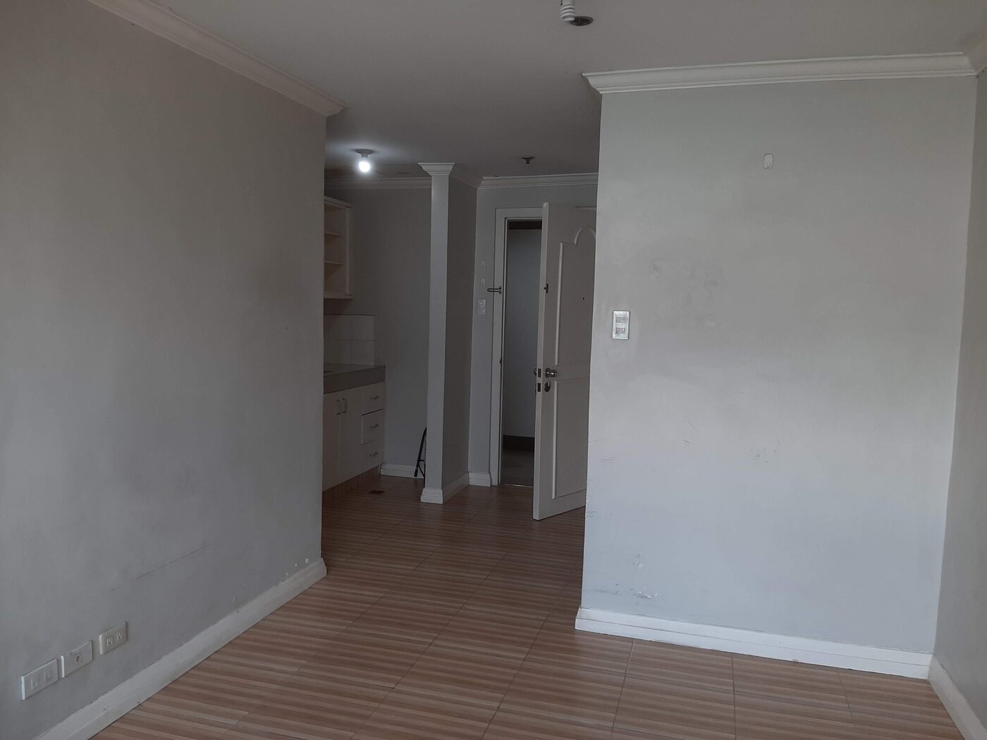 Studio interior at Palm Towers Makati looking toward the kitchenette and entry door