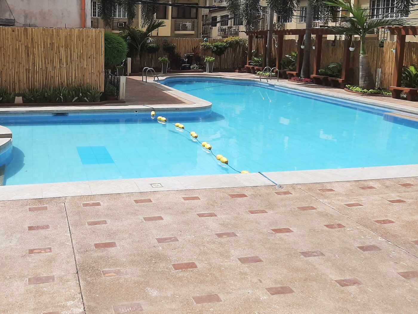 Resident swimming pool and jacuzzi at Palm Towers, San Antonio Village, Makati